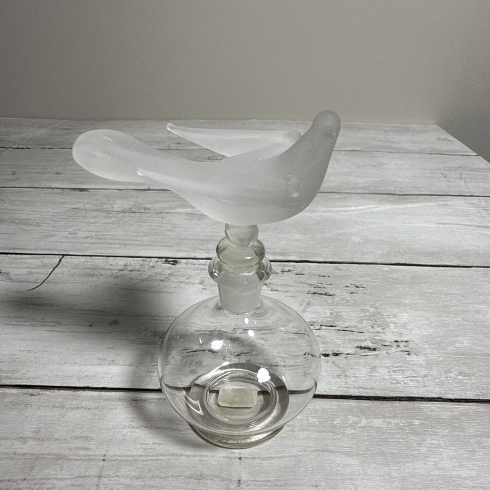 Faroy frosted glass perfume bottle with a stylized bird finial.